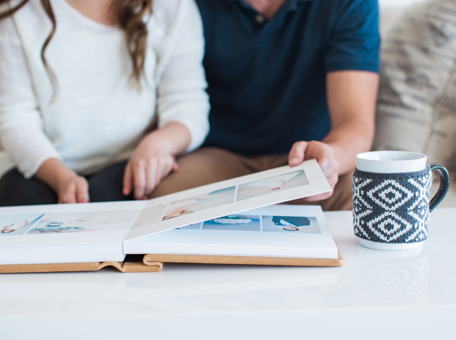 Wedding photographer presenting portfolio and contract details to clients.